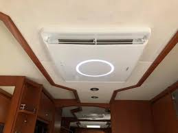 GREE GRH120DA indoor ceiling panel with LED light inside a motorhome